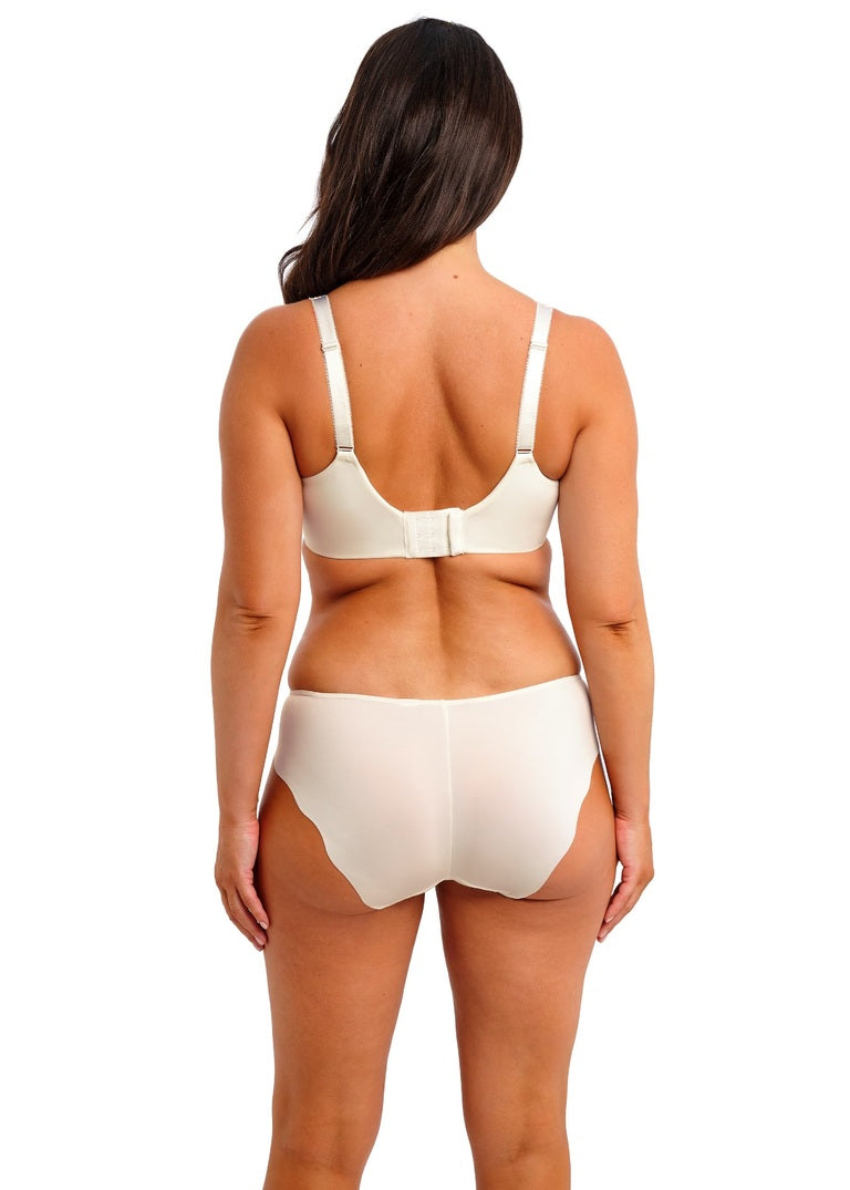 Woman wearing a beige bra and panties set on a white background available at Leia Lingerie