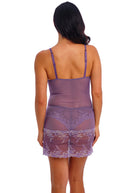Purple lace nightgown worn by a person on a white background