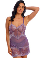 Woman wearing a purple lace lingerie set on a white background