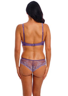 Woman wearing a purple lingerie set on a white background