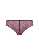 Wacoal's tanga brief in burgundy with pink lace worn by a person on a white background