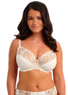 Woman wearing a white lace bra and panties set on a white background available at Leia Lingerie